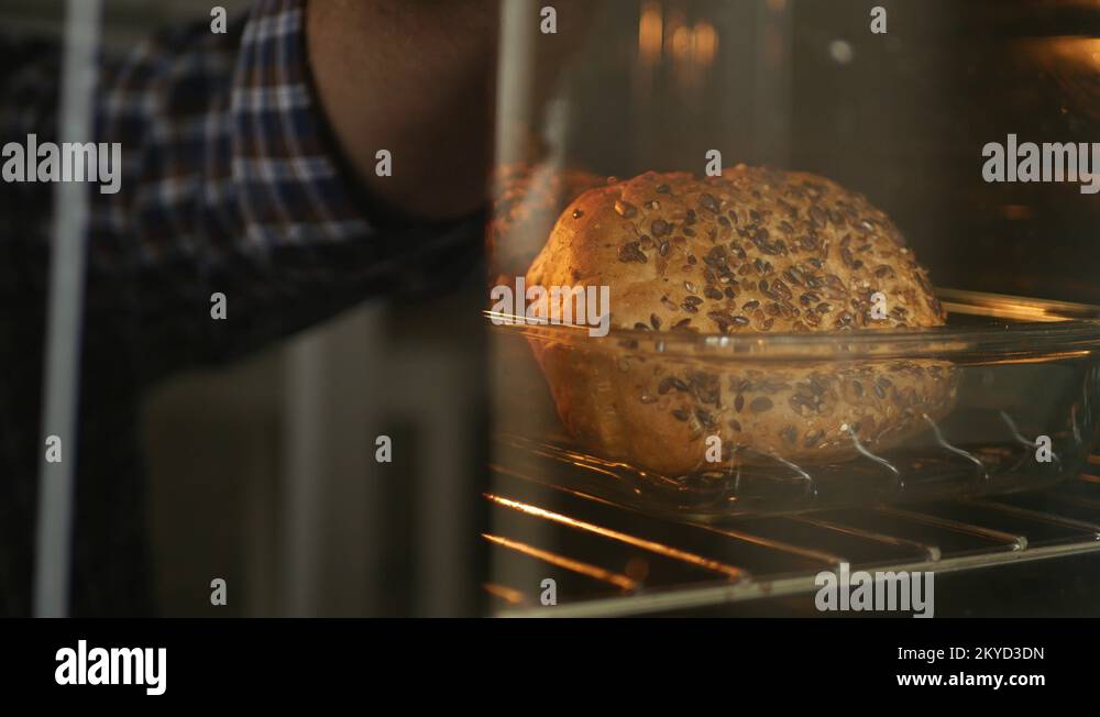 Man Image Reflected in Oven Glass Open Door and Start Fire with Matches