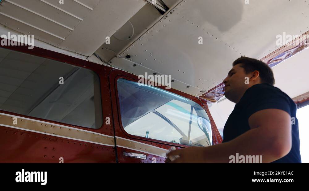 Engineer removing fuel form fuel tank drain valve 4k Stock Video