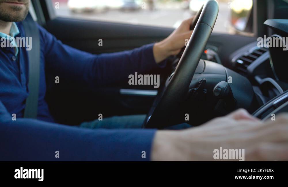 Man driving in innovative automated car using selfparking autopilot