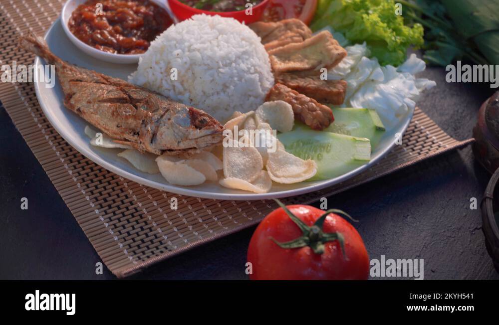 malaysian indonesian spicy rice with mackerel Stock Video Footage Alamy