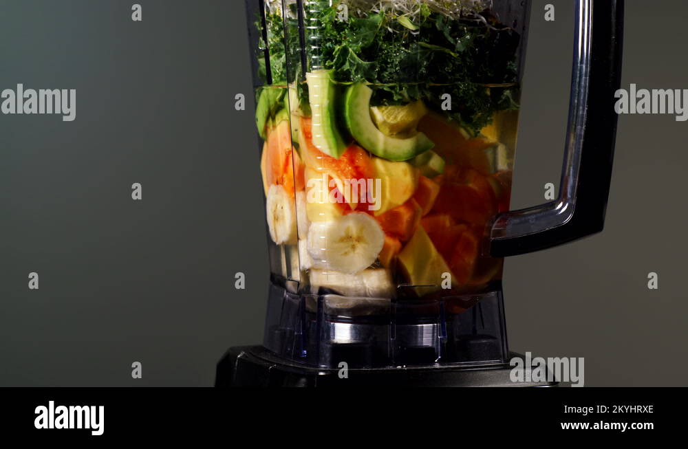 Making fruits shake with papaya in blender Stock Video Footage Alamy