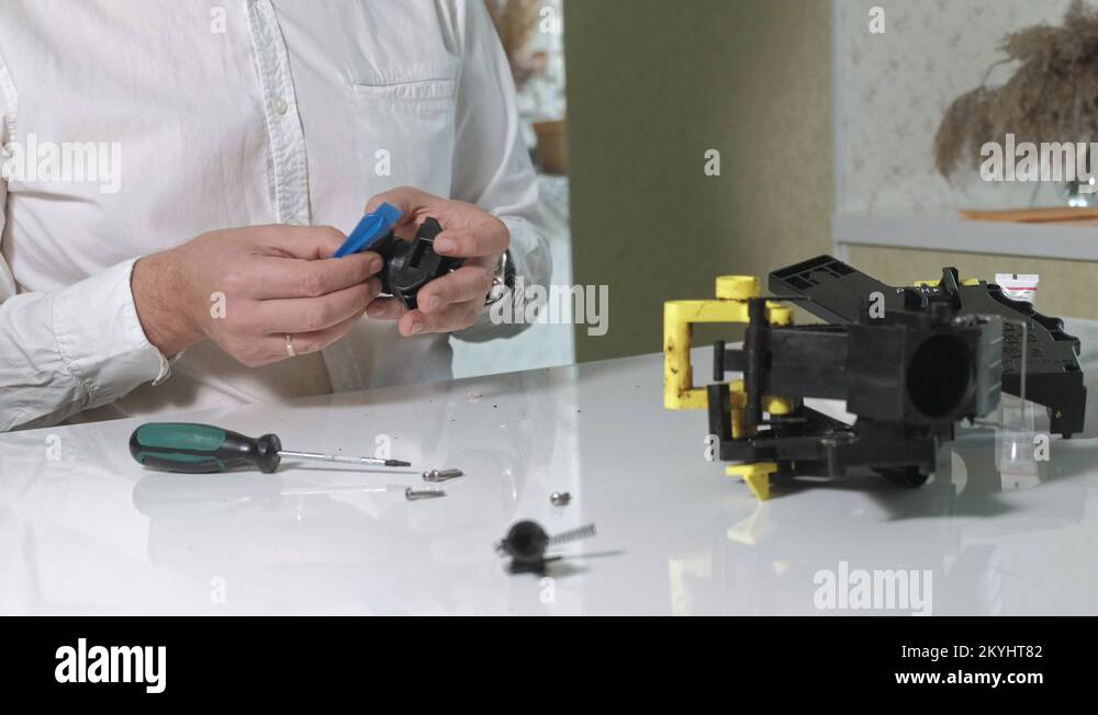 A man repairs a coffee machine coffee machine, coffee maker repair shop