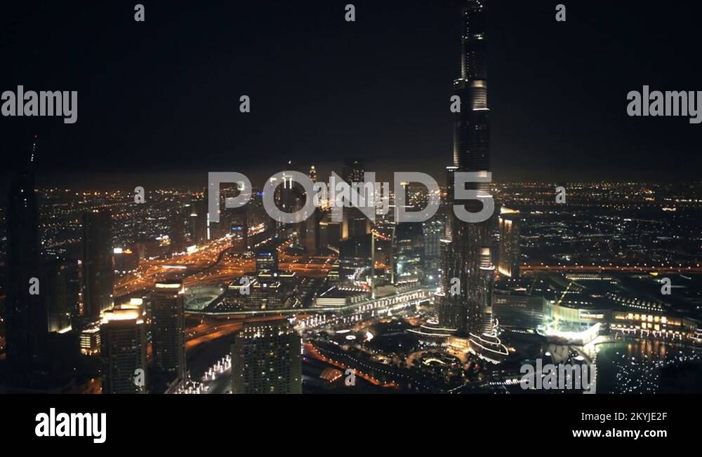 Pan right at 300m, from Sheikh Zayed Road, past Burj Khalifa, to