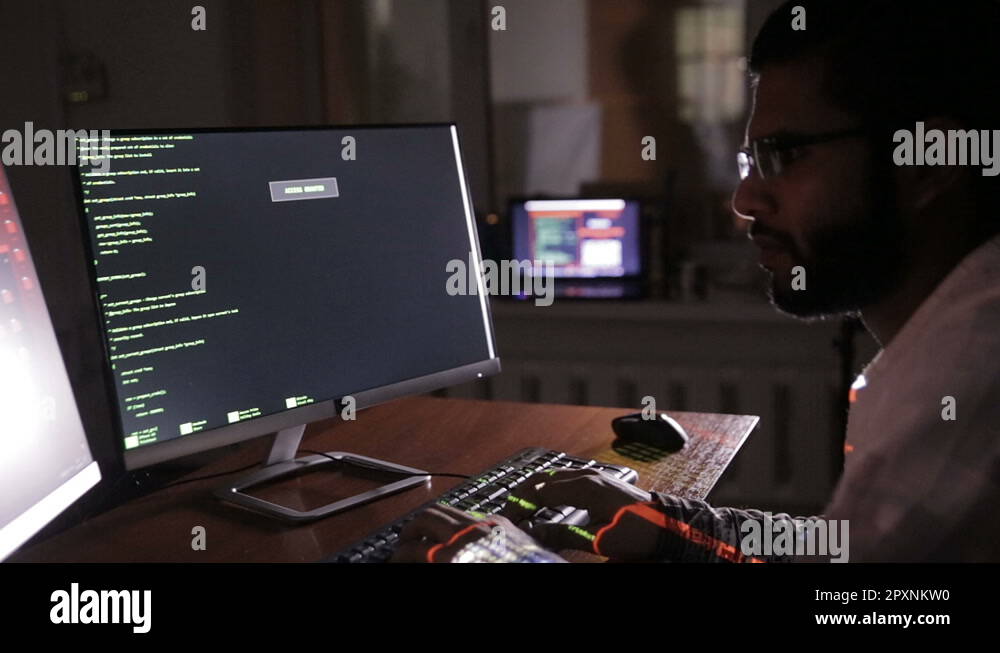 Hacker's hands typing codes on the keyboard. Hacks program code ...