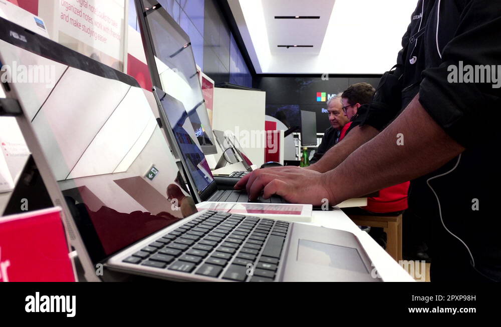 People playing new computer at Microsoft store in Burnaby BC Canada