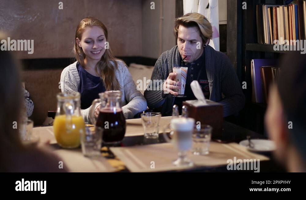 College students having coffee together in cafe Stock Video Footage Alamy