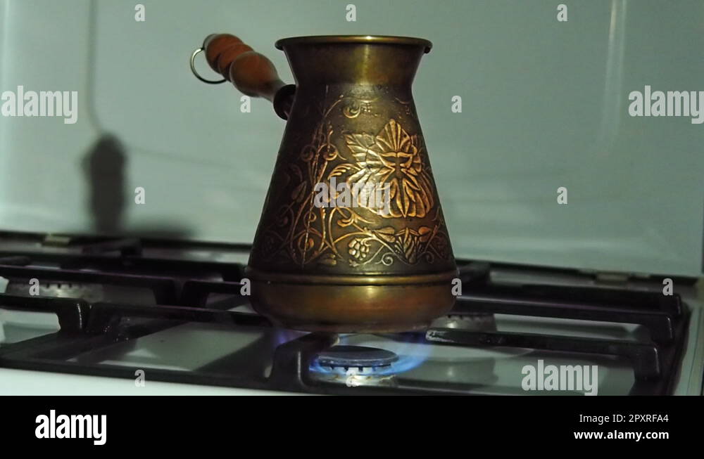 https://c8.alamy.com/comp/2pxrfa4/coffee-turka-on-fire-on-the-gas-stove-is-a-copper-engraved-turk-coffee-brewer-2pxrfa4.jpg