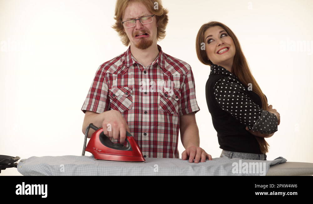 Funny couple irons clothes on ironing board 4K Stock Video Footage Alamy