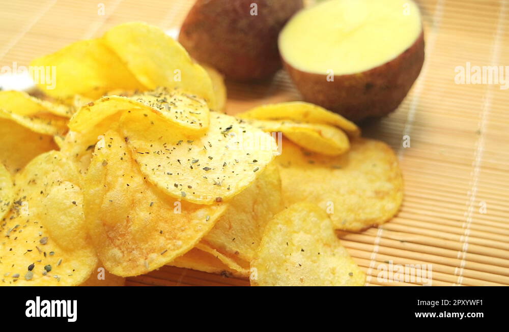 Homemade potato chips. Fast food. Popular junk food. Potato tubers and
