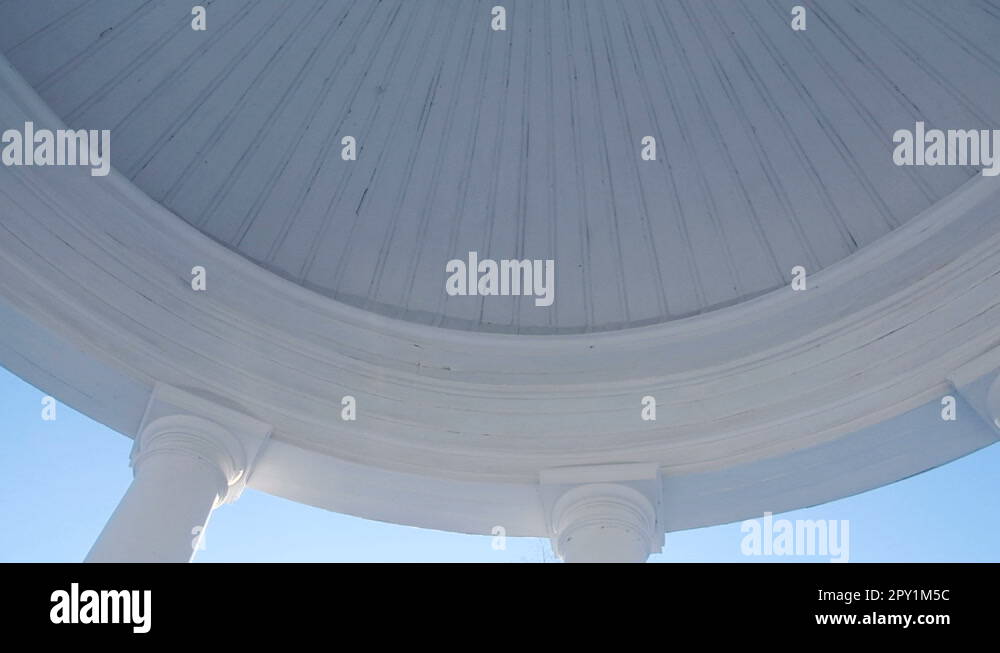 Gazebo inside, with views of the clear sky. Camera movement around Stock Video Footage Alamy
