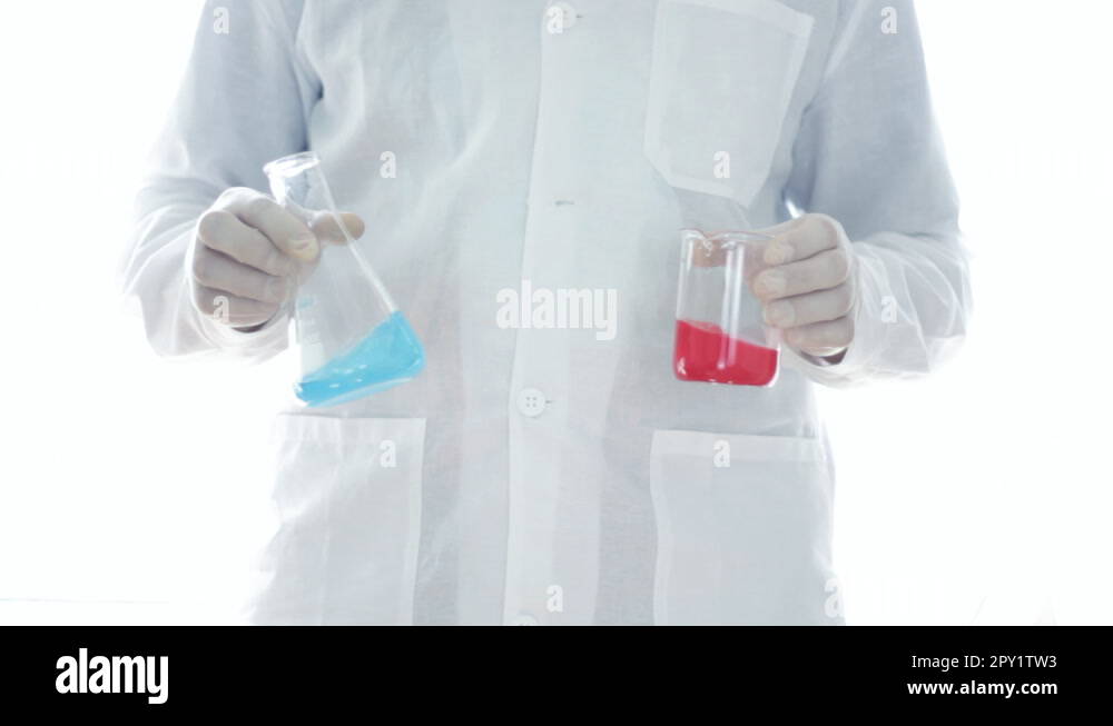 Scientist hands comparing chemicals in Erlenmeyer flask and beaker HD