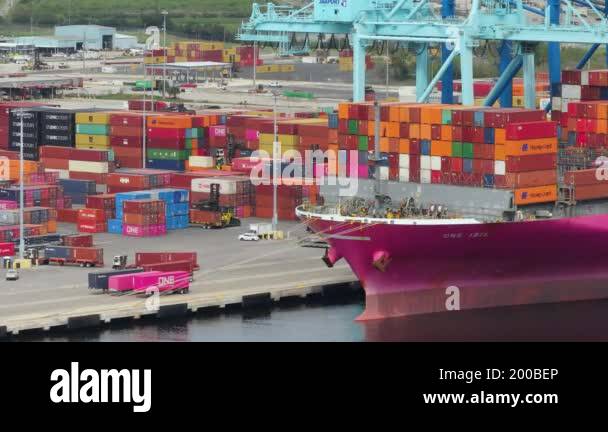 Crane loading cargo containers to container ship in international port ...