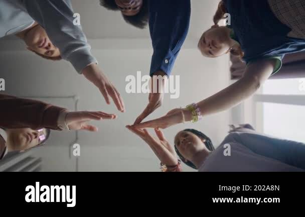 Bottom view shot of young Black female supervisor with multiethnic ...