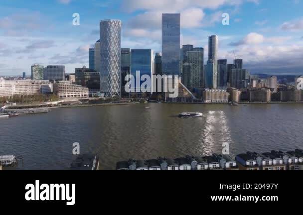 Aerial view of Canary Wharf's modern skyscrapers and the River Thames ...