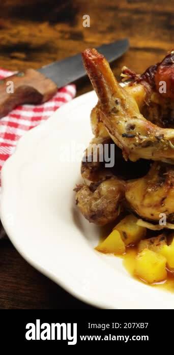 Roasted farm chicken and hash browns in a dish Stock Video Footage - Alamy