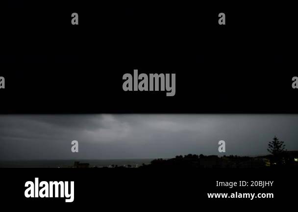 Lightning Flashes Illuminate The Night Sky During Thunderstorm Stock ...