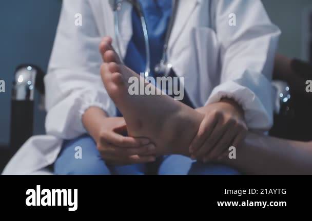 doctor examining patient 's feet in clinic Stock Video Footage - Alamy