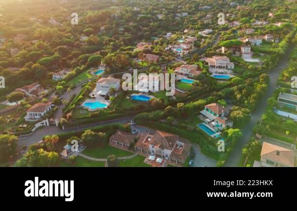 Image showcasing Aerial view of luxury villas with pools and gardens on the French ...