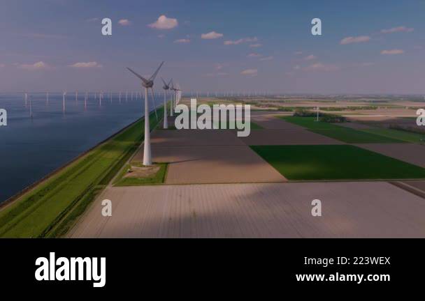 Experience the beauty of windmill turbines gracefully rotating in the ...
