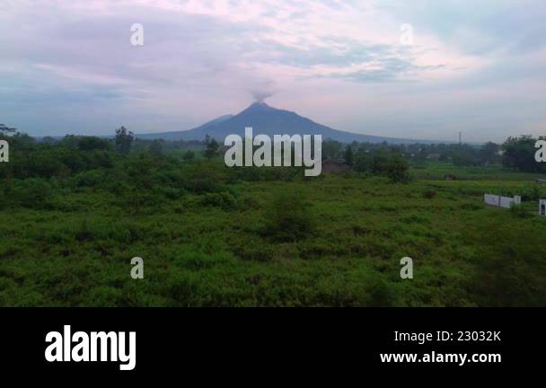 4k aerial footage of the panoramic beauty of Mount Merapi as the sun ...