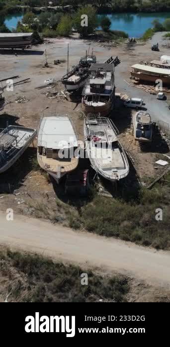 Shipyard by the river, Aerial view of boats under construction at a ...
