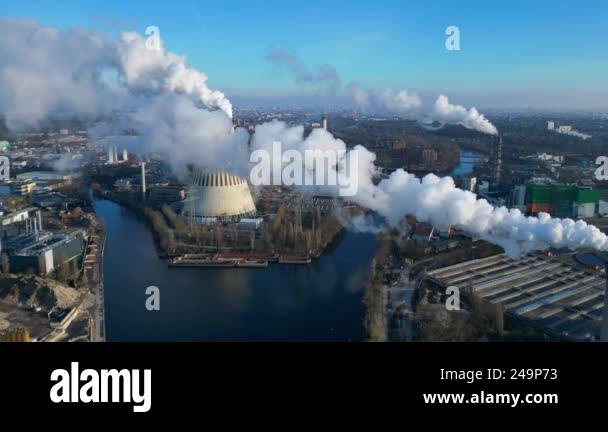 Aerial view of a waste to energy plant emitting smoke from its chimney ...