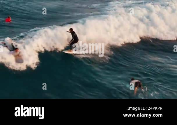 HURAA, MALDIVES - OCTOBER 28, 2024: Surfing collision. Man and woman ...