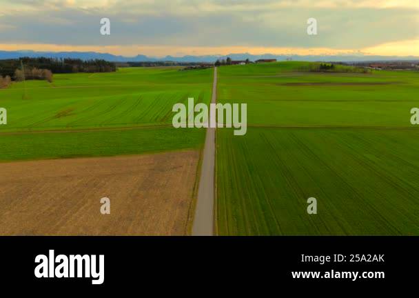 Aerial view of green fields in spring, Bavaria, Germany, showcasing ...