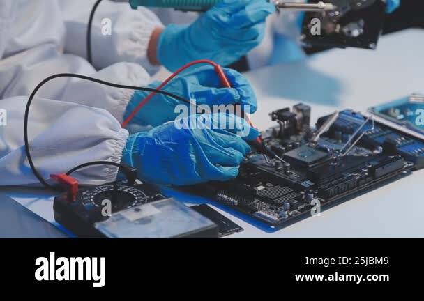 scientist in lab coat holding microcircuit board and microcircuit Stock ...