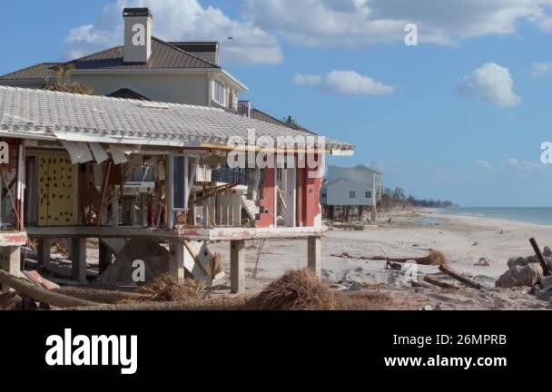 Storm surge severe damage to residential houses on ocean shore after ...