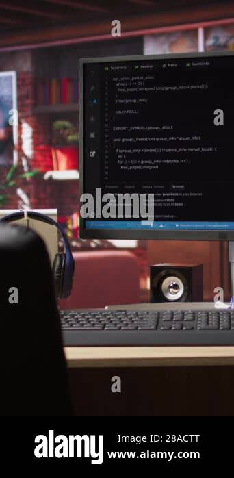 Vertical video Coding interface shown on computer screen on desk in ...