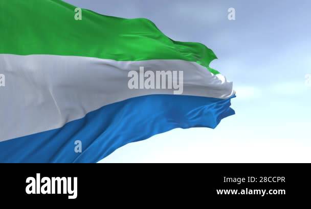 Close-up of Sierra Leone national flag waving in the wind on a clear ...