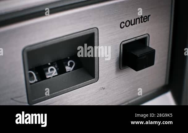 Close-up on a retro audio device counter as the numbers increment. The ...
