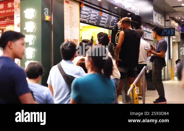 Queue at a food kiosk in Hong Kong Stock Video Footage - Alamy