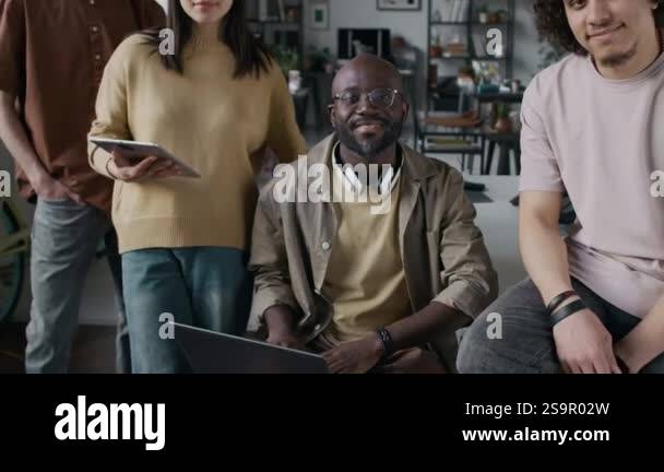 Zoom out portrait of four diverse young programmers wearing casual ...