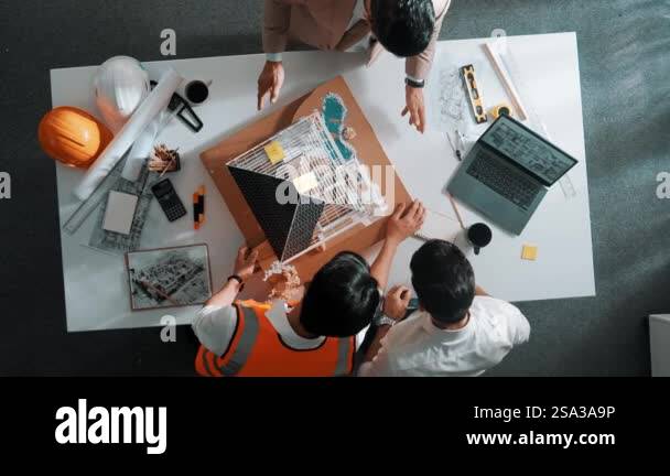 Top aerial view of architect engineer team stick sticky notes on house ...