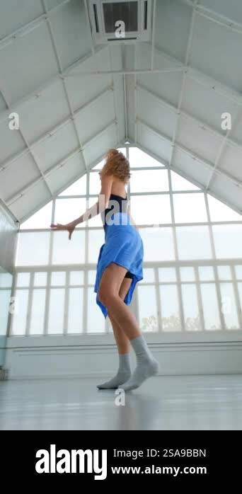 Medium shot of a female dancer performing an energetic and powerful ...