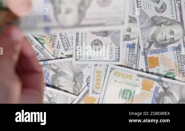 Hands counting and throwing dollar bills in motion, creating a dynamic ...