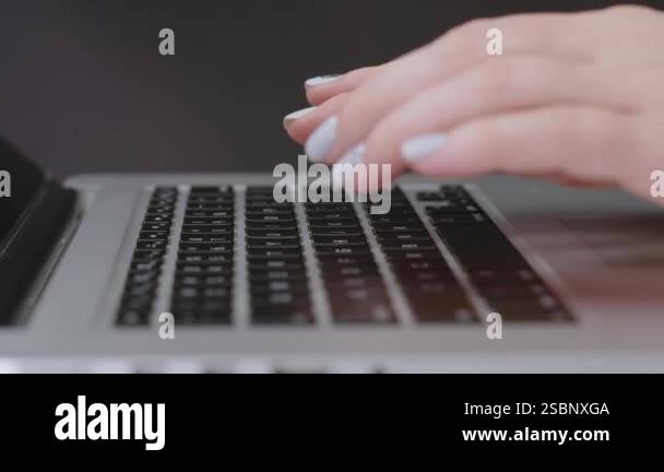 Close-up shot of laptop, hands, fingers of anonymous female programmer ...