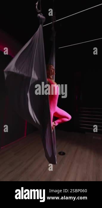 aerial shot of woman doing aerial exercise in hammock Stock Video ...