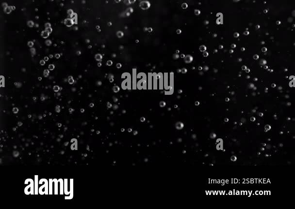 Super Slow Motion Shot of Air Bubbles Rising up, Isolated on Black ...