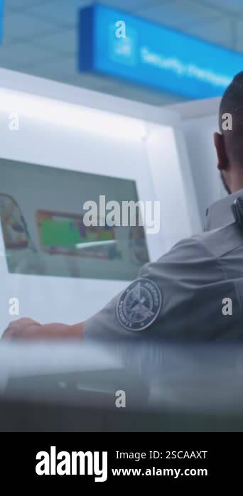 Airport Terminal: African American Security Officer Monitors Baggage ...