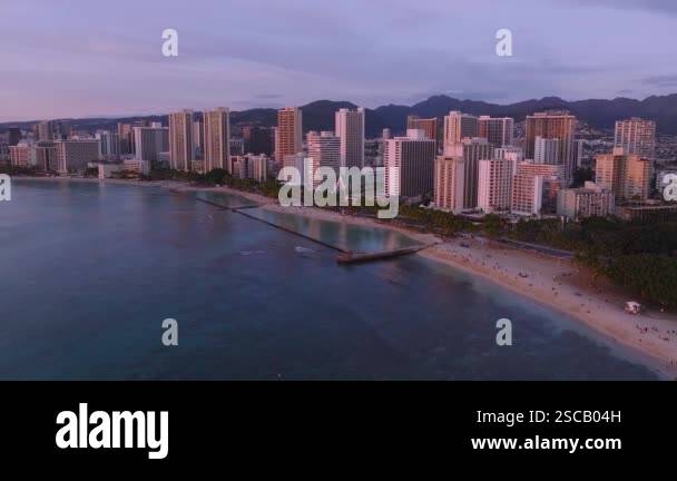 Aerial view of Waikiki Beach purple sunset in Honolulu, Hawaii, at ...