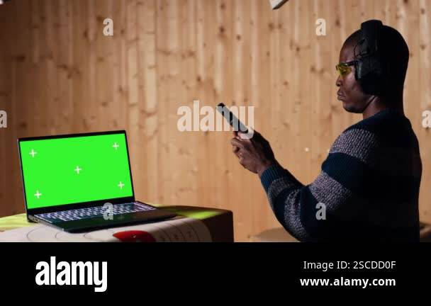 Chroma key notebook and shooting range customer reloading pistol ...