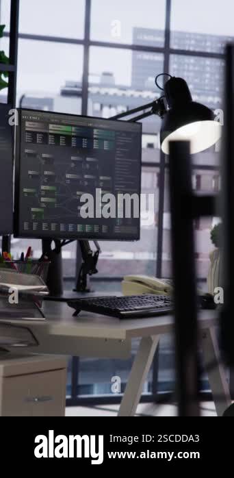 Vertical video PC in startup office used to design and implement ...