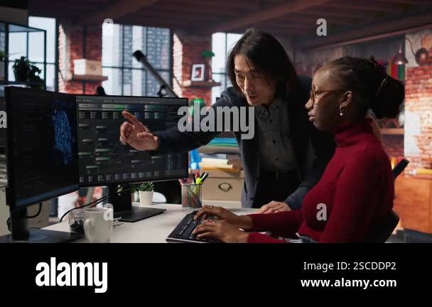 Man in AI startup office CTO position overseeing software engineer ...