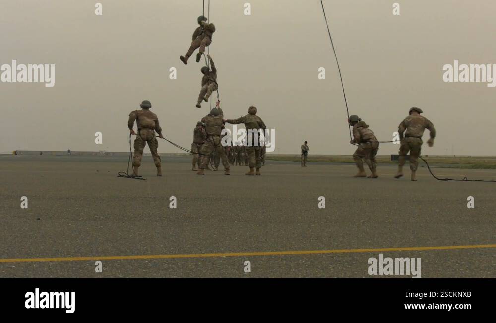 Soldiers fast rope from UH-60 Black Hawk at Camp Buehring, Kuwait Stock ...