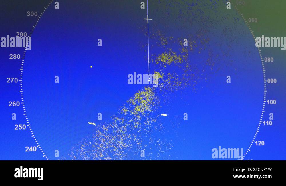 PC monitor working as smart radar with dots and texts on a cargo ship ...