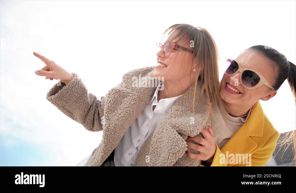 Hugging A Lod Two Happy Sisters Hugging Together. Fashion Girls Having a lot of Fun ...
