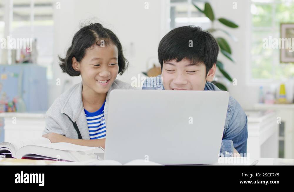 Young boys are using computers to teach and explain homework Stock ...